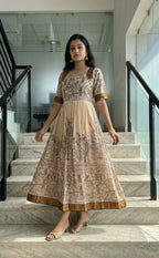 Cream Masriser Kalamkari Panel printed Kurti Gown with contrast Golden Border work